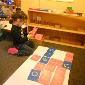 A girl learning to spell at our Montessori school in Oakdale, MN-4a0f426a42
