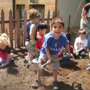 Children digging in dirt at Montessori school in Oakdale, MN-096c133bd4