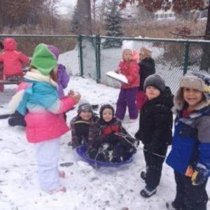 Kids having fun in the snow at our Montessori school in Roseville, MN-0569e0ee2c