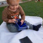 Baby exploring fabrics.