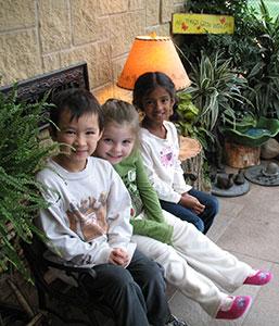 Happy Kids Sitting Together — Minneapolis, MN — Miniapple International Montessori
