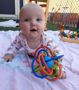 Adorable Baby Playing his Toy — Minneapolis, MN — Miniapple International Montessori