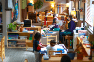 Group of School Kids with Teacher Sitting in Classroom — Minneapolis, MN — Miniapple International Montessori
