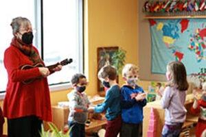 A Teacher Sings in Class with Her Students — Minneapolis, MN — Miniapple International Montessori