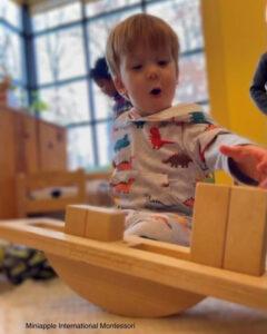  — Minneapolis, MN Boy Playing with Wooden Blocks at School — Miniapple International Montessori